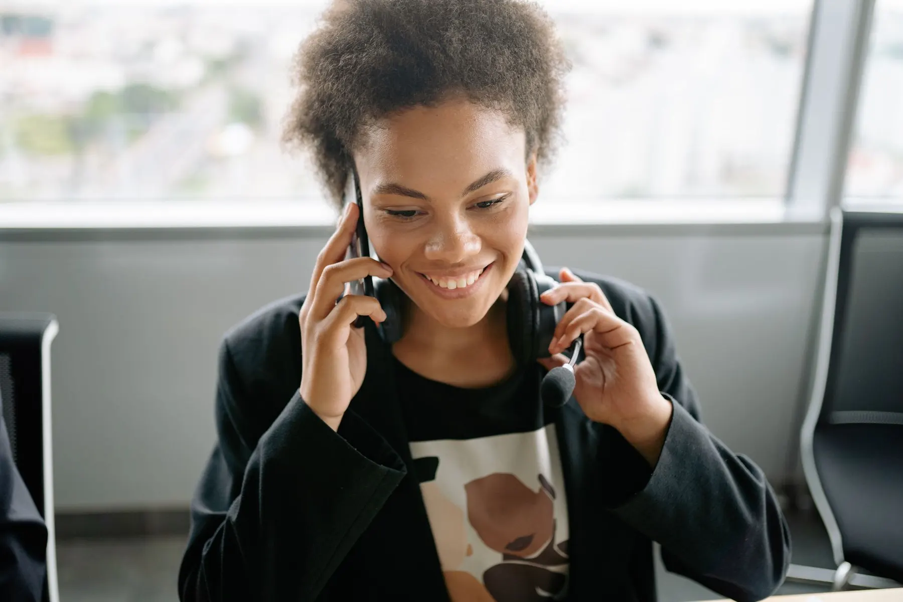 Support professional responding to a caller at a workstation