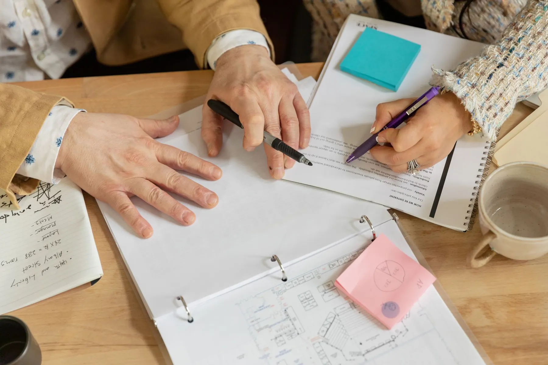 Colleagues reviewing a business proposal together